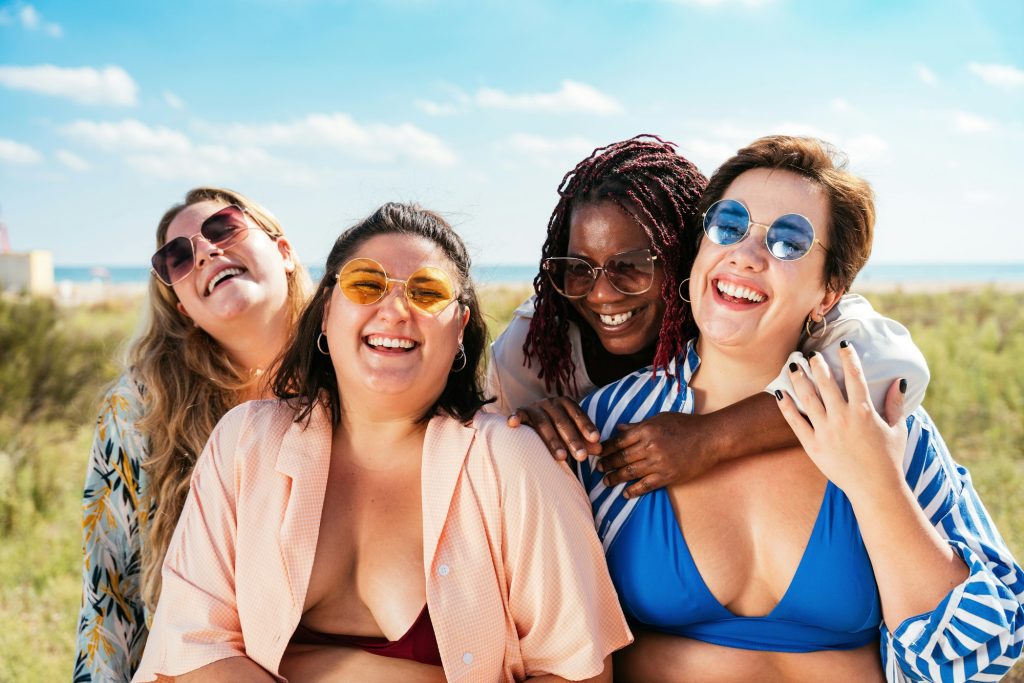 Group of plus size women with swimwear at the beach