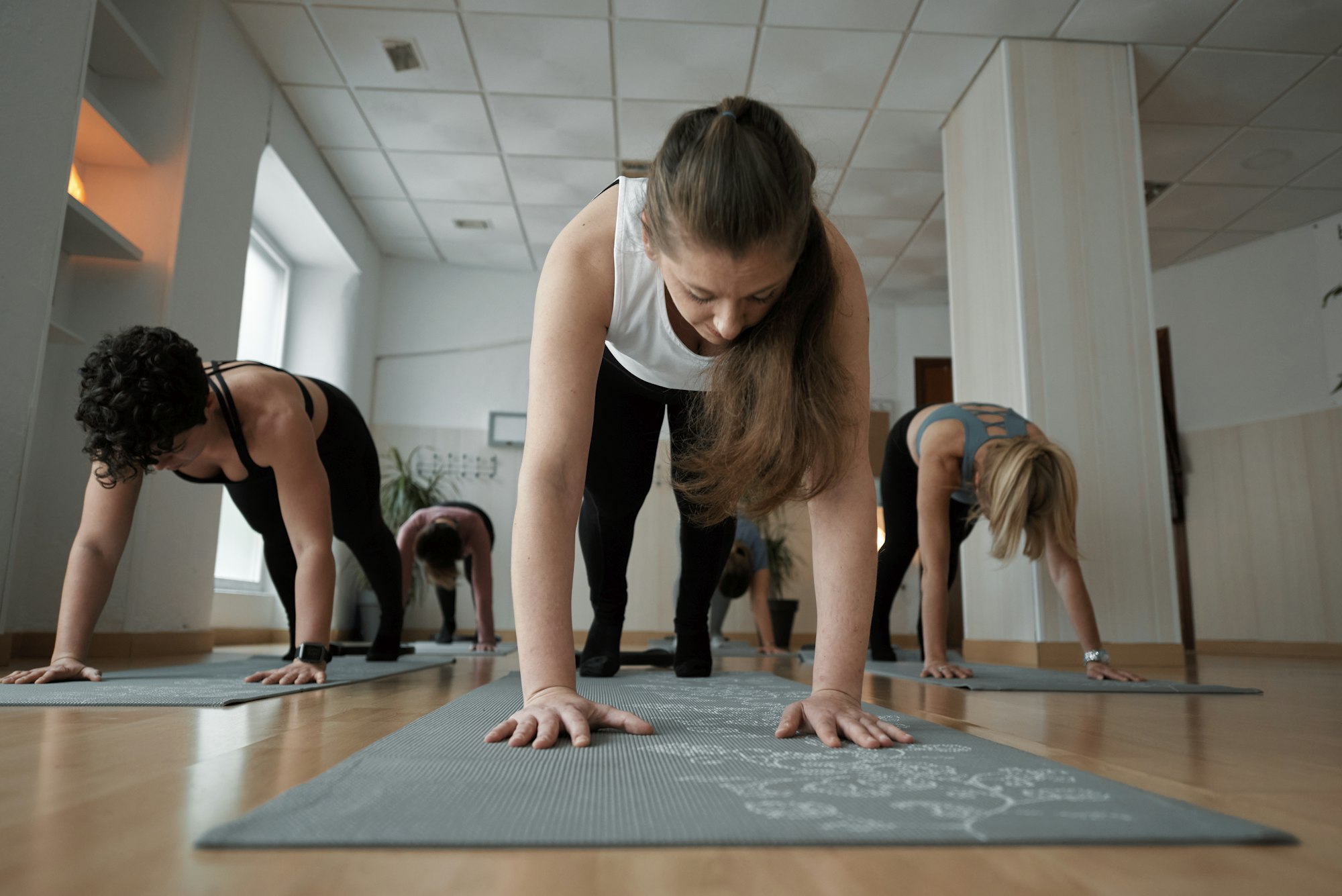 Pilates instructor giving a Pilates class